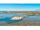 Aerial view of waterfront property with beach access and lush landscaping at 300 S Florida Ave # 400D, Tarpon Springs, FL 34689