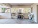 Community BBQ area with grill, utensils and propane tanks at 300 S Florida Ave # 400D, Tarpon Springs, FL 34689