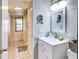 Clean bathroom with white vanity, and view of hallway at 300 S Florida Ave # 400D, Tarpon Springs, FL 34689