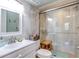 Bright bathroom with white vanity, walk-in shower, and updated fixtures at 300 S Florida Ave # 400D, Tarpon Springs, FL 34689