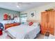 Spacious bedroom with king-size bed and ample closet space at 300 S Florida Ave # 400D, Tarpon Springs, FL 34689