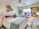 Bedroom with queen bed, unique wall decor, and built-in shelves at 300 S Florida Ave # 400D, Tarpon Springs, FL 34689
