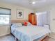Comfortable king-size bed in a bedroom with sliding door access at 300 S Florida Ave # 400D, Tarpon Springs, FL 34689