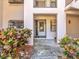 Condo building entryway with decorative plants at 300 S Florida Ave # 400D, Tarpon Springs, FL 34689