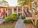 Condo building entrance with stairs and landscaping at 300 S Florida Ave # 400D, Tarpon Springs, FL 34689