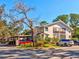 Building exterior with parking and landscaping at 300 S Florida Ave # 400D, Tarpon Springs, FL 34689