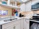 Updated kitchen with granite countertops and stainless appliances at 300 S Florida Ave # 400D, Tarpon Springs, FL 34689