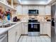 Modern kitchen with stainless steel appliances and granite counters at 300 S Florida Ave # 400D, Tarpon Springs, FL 34689