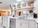 Well-equipped kitchen with granite counters and open shelving at 300 S Florida Ave # 400D, Tarpon Springs, FL 34689
