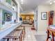 Open floor plan with kitchen, living room, and breakfast bar at 300 S Florida Ave # 400D, Tarpon Springs, FL 34689