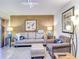 Living room with a light and airy feel, featuring comfortable seating at 300 S Florida Ave # 400D, Tarpon Springs, FL 34689