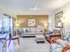 Spacious living room with a neutral color palette and large artwork at 300 S Florida Ave # 400D, Tarpon Springs, FL 34689