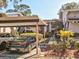 Condo building with covered parking and landscaping at 300 S Florida Ave # 400D, Tarpon Springs, FL 34689