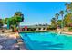 Relaxing community pool with patio furniture and waterfront views at 300 S Florida Ave # 400D, Tarpon Springs, FL 34689