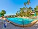 Inviting community pool with lounge chairs and water view at 300 S Florida Ave # 400D, Tarpon Springs, FL 34689