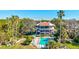 Community pool with lounge chairs and palm trees at 300 S Florida Ave # 400D, Tarpon Springs, FL 34689