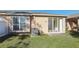 Private backyard with sliding glass doors and grass at 31447 Shaker Cir, Wesley Chapel, FL 33543