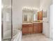 Double sink bathroom with a large bathtub and shower at 31447 Shaker Cir, Wesley Chapel, FL 33543