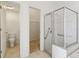 Bathroom featuring a walk-in shower and toilet at 31447 Shaker Cir, Wesley Chapel, FL 33543