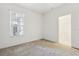 Bright bedroom with window, closet and door to bathroom at 31447 Shaker Cir, Wesley Chapel, FL 33543