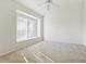Spacious bedroom with large window and ceiling fan at 31447 Shaker Cir, Wesley Chapel, FL 33543