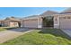 House exterior showcasing a two-car garage and landscaping at 31447 Shaker Cir, Wesley Chapel, FL 33543