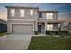 Two-story house with a neutral color scheme and a two-car garage at 32664 Pez Landing Ln, Wesley Chapel, FL 33543