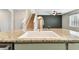 Kitchen island with granite countertop and a farmhouse sink at 32664 Pez Landing Ln, Wesley Chapel, FL 33543