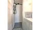 Shower with updated tile and shelving at 34483 Cactus N Dr, Pinellas Park, FL 33781