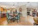 Open dining area with hardwood floors and a charming wooden table at 37539 Gill Ave, Zephyrhills, FL 33541