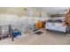 Attached garage with car and additional storage space at 37539 Gill Ave, Zephyrhills, FL 33541