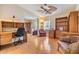 Home office with built-in shelving and comfortable seating at 37539 Gill Ave, Zephyrhills, FL 33541