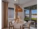Casual dining area with round table, chairs, and sliding glass doors to backyard at 4177 Feldspar Ln, Spring Hill, FL 34609