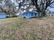 Blue house with large oak tree and yard at 4901 E Hanna Ave, Tampa, FL 33610