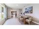 Bright dining area with hardwood floors and a view to the kitchen at 5354 Oxford Gray Rd, Wesley Chapel, FL 33545