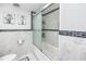 Updated bathroom with a large shower/tub combo and modern tile at 5728 14Th N Ave # 305B, St Petersburg, FL 33710