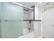 Clean bathroom, featuring a tub shower and frosted glass door at 5728 14Th N Ave # 305B, St Petersburg, FL 33710