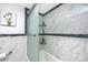 Bathroom with shower and tub, and glass sliding door at 5728 14Th N Ave # 305B, St Petersburg, FL 33710