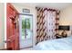 Bedroom with sliding door to balcony and king-size bed at 5728 14Th N Ave # 305B, St Petersburg, FL 33710