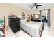 Bright bedroom with a double bed and dresser, near balcony access at 5728 14Th N Ave # 305B, St Petersburg, FL 33710