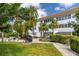 Community courtyard with grill, seating, and tropical landscaping at 5728 14Th N Ave # 305B, St Petersburg, FL 33710