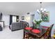 Dining area with dark wood table and chairs, offering view of living room at 5728 14Th N Ave # 305B, St Petersburg, FL 33710