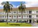 Two-story building with lush landscaping and palm trees at 5728 14Th N Ave # 305B, St Petersburg, FL 33710