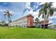 Two-story building with lush lawn and palm trees at 5728 14Th N Ave # 305B, St Petersburg, FL 33710