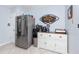 Stainless steel refrigerator and white cabinets highlight this kitchen at 5728 14Th N Ave # 305B, St Petersburg, FL 33710