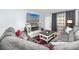 Comfortable living room featuring a fireplace and large TV at 5728 14Th N Ave # 305B, St Petersburg, FL 33710