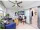 Sunroom with sofa, ceiling fan and sliding doors leading to other rooms at 5728 14Th N Ave # 305B, St Petersburg, FL 33710