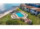 Aerial view of resort-style pool, sundeck, and waterfront location at 6287 Bahia Del Mar Cir # 114, St Petersburg, FL 33715