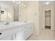 Bathroom boasts double sinks, a shower, and linen closet at 6515 Clair Shore Dr, Apollo Beach, FL 33572