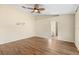Spacious bedroom with wood-look floors and ceiling fan at 6515 Clair Shore Dr, Apollo Beach, FL 33572